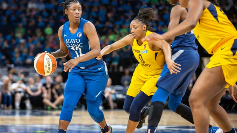 Lynx player Alexis Jones drives past Indiana Fever defender during 2026 WNBA game