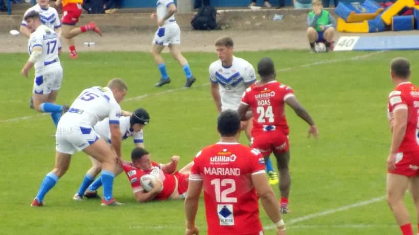 Rugby league player grabbed during a tackle in an English Super League match