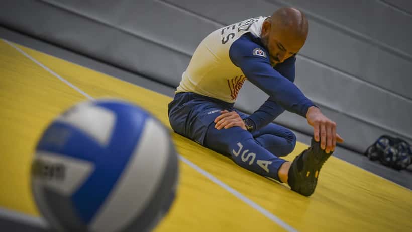 Invictus Games veteran athletes practising sitting volleyball at an adaptive sports event