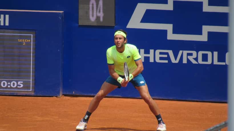 Tomas Etcheverry competing at the Córdoba Open ATP tournament, clay court baseline player in action