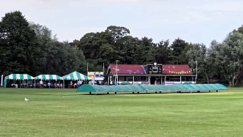 Cricket pitch covers laid out during rain at an English cricket ground