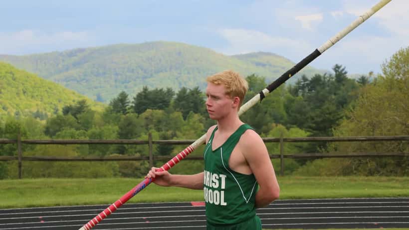 Pole vaulter clearing the bar at a competition, illustrating the elite athletics context of the Alysha Newman case