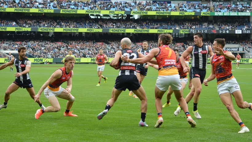 Steele Sidebottom in action during an AFL match, representing a career spanning 373 games and 18 seasons with Collingwood