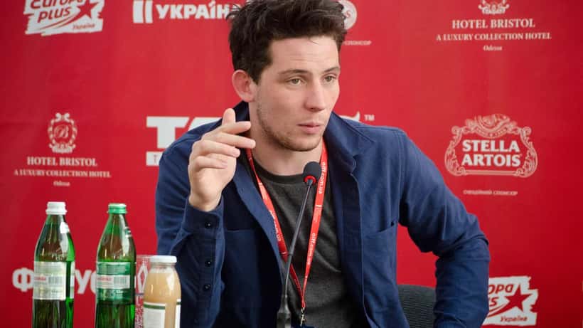 Josh O'Connor at film festival, actor known for The Crown and Challengers