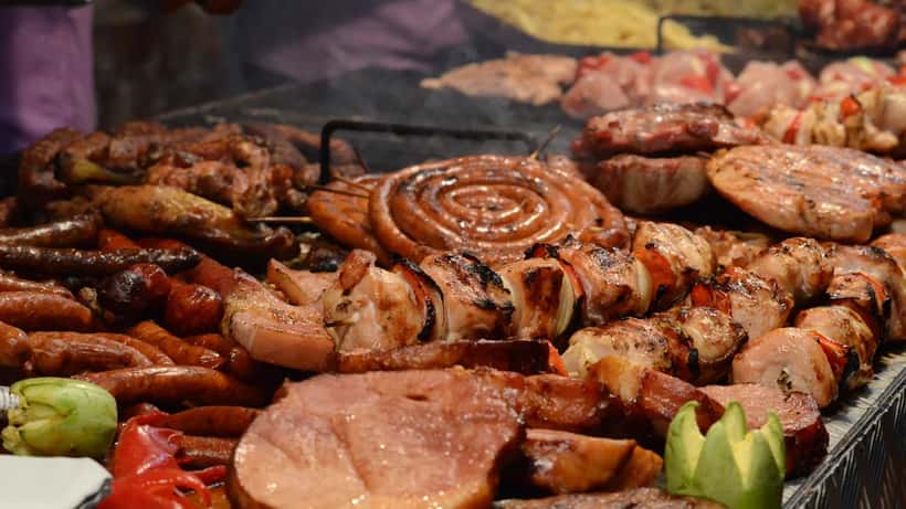 Barbecue food grilling on outdoor grill at summer holiday cookout