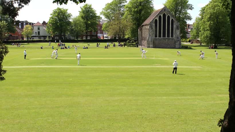Cricket match in the UK — players competing on a summer afternoon at a county ground