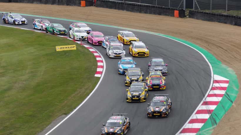 BTCC cars racing on track at Brands Hatch circuit
