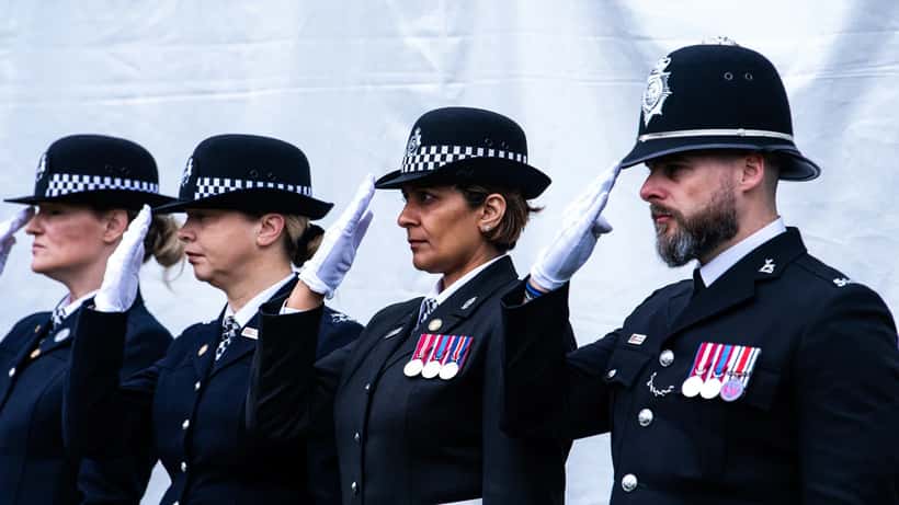 Police officers in uniform at a memorial service for fallen colleagues