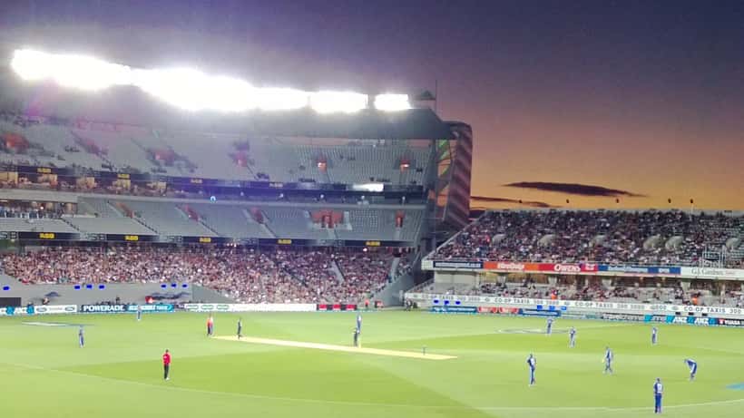 Eden Park Auckland stadium at dusk illuminated for evening match