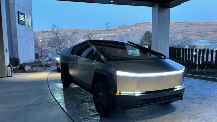 Tesla Cybertruck parked outdoors in Moab Utah desert landscape