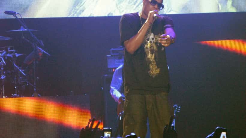 Jay-Z performing live at outdoor concert venue