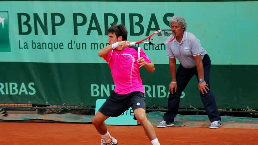 Tennis player on clay court mid-match, representative of the Rome Open 2026 tournament conditions