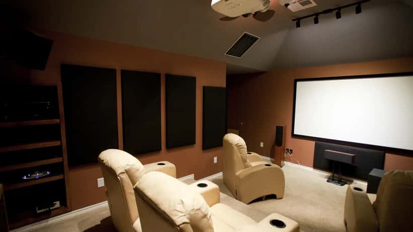 Dedicated home theatre projection room with large screen and surround sound — comparing cinema vs home setup for Dune 3 IMAX 70mm
