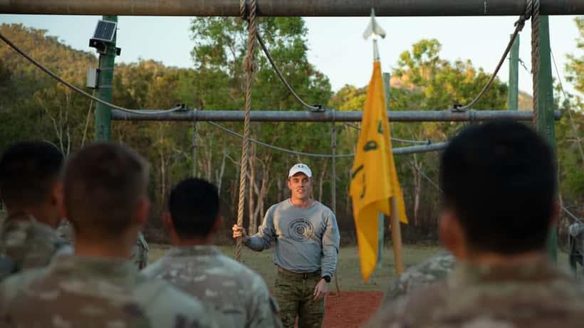 Australian Defence Force soldiers training together in a joint military exercise in the field
