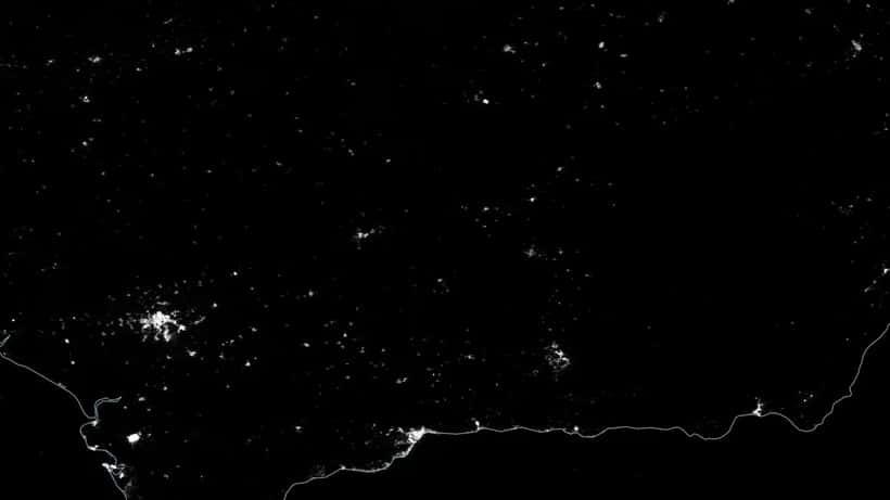 NASA satellite image showing power blackout, dark regions without electricity at night