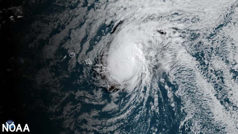 Satellite view of a Category 3 hurricane approaching Hawaii's Big Island, showing the storm system over the Pacific Ocean