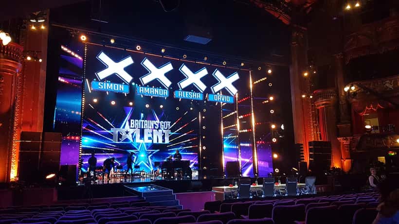 Britain's Got Talent audition stage set with judges table and studio spotlights
