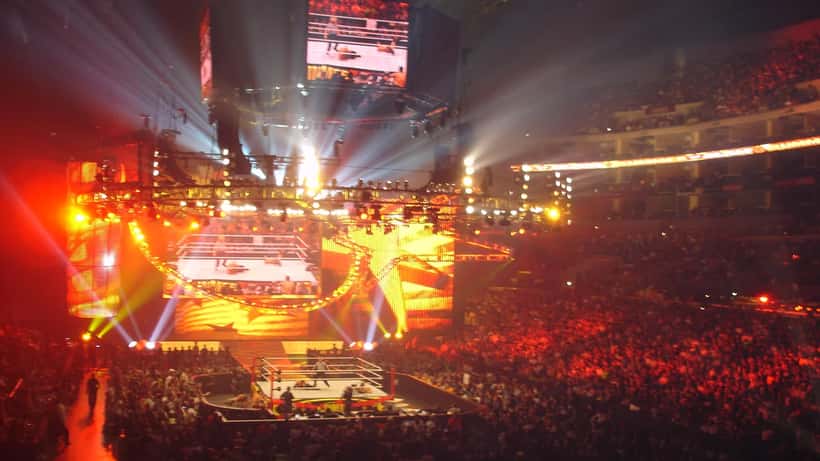WWE SummerSlam live arena with ring and crowd, entertainment event