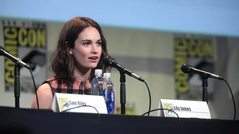 Lily James actress at public event, smiling at camera
