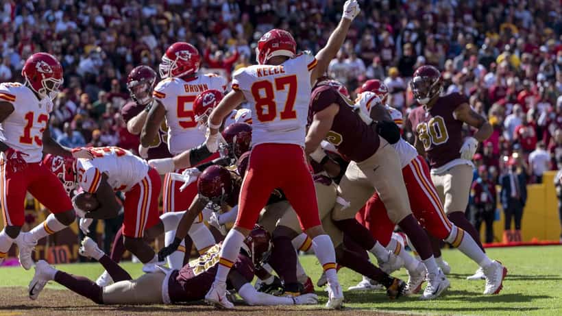 Travis Kelce playing American football at an NFL game