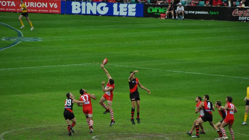 AFL players in a ruck contest during a Sydney Swans game