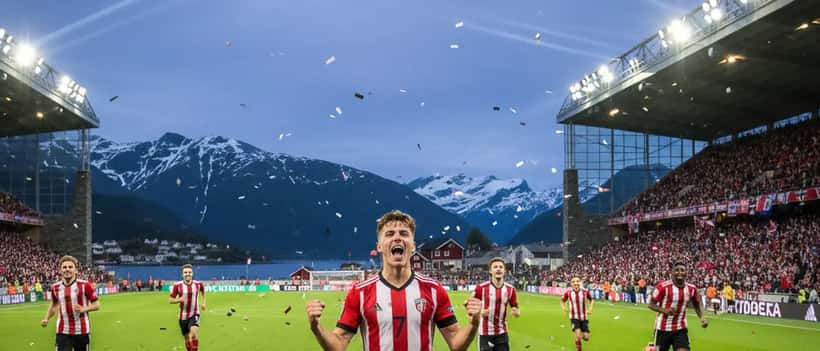 Ung fotballspiller i rødt og hvitt trøye feirer mål på europeisk stadion, knyttede never i været, med teammates og stadionlys