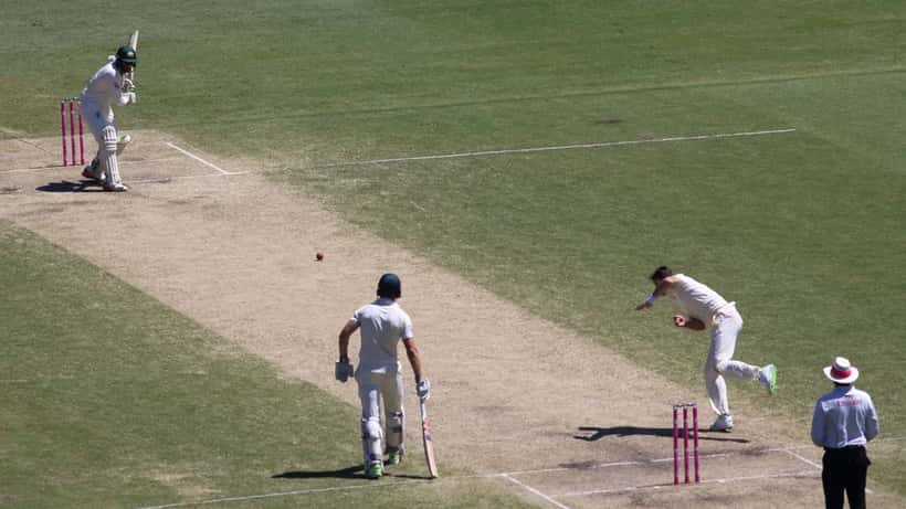 Cricket bowler in action at Sydney cricket ground, representing sports law and player conduct in Australian cricket