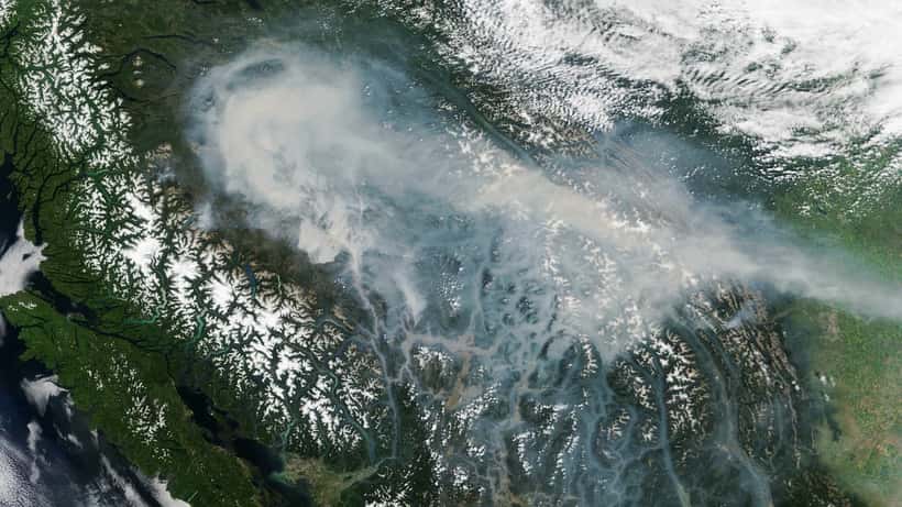 Satellite view of BC wildfires sending smoke skyward, NASA MODIS image, British Columbia