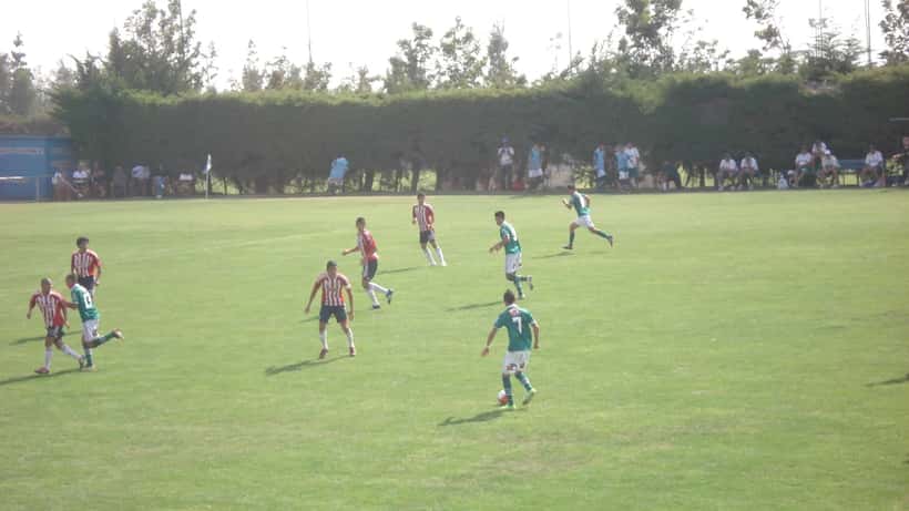 Chivas de Guadalajara and Santiago Wanderers youth players compete in a football match