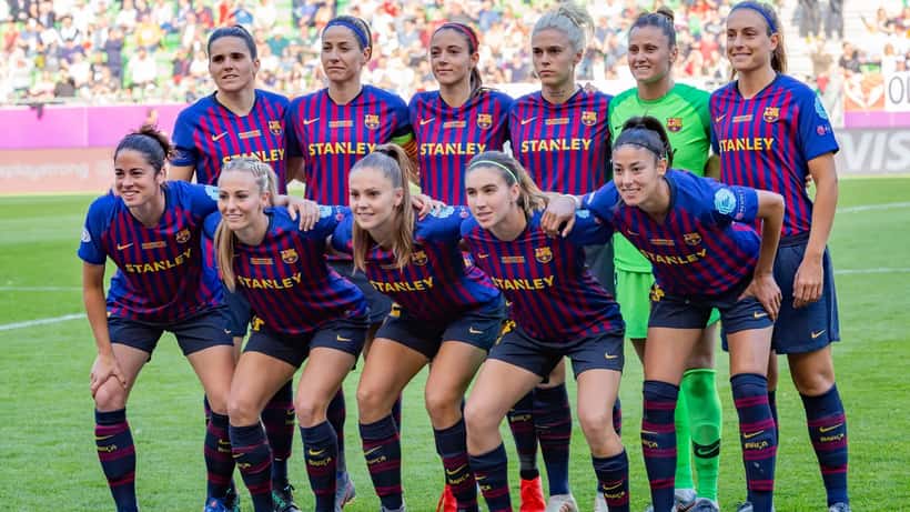 FC Barcelona women's team walking onto the pitch at the UEFA Women's Champions League