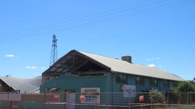 Cyclone damage to a building in Perenjori, Western Australia — roof torn and walls damaged