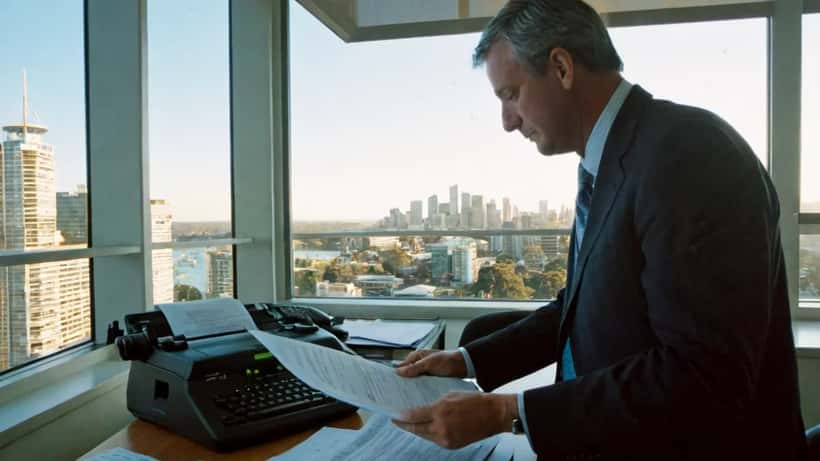 Australian entertainment lawyer reviewing film production contracts in a Sydney law office