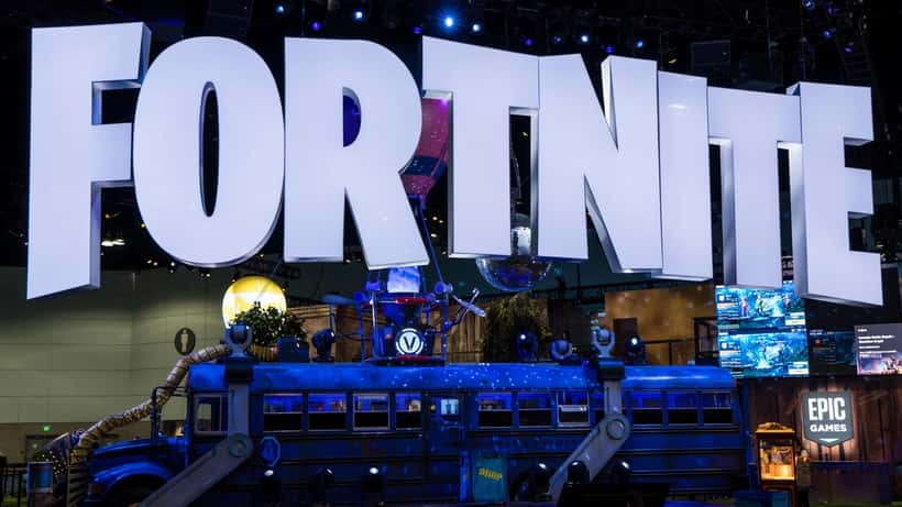 Young gamer at Fortnite gaming setup illustrating cybersecurity risk from admin panel phishing