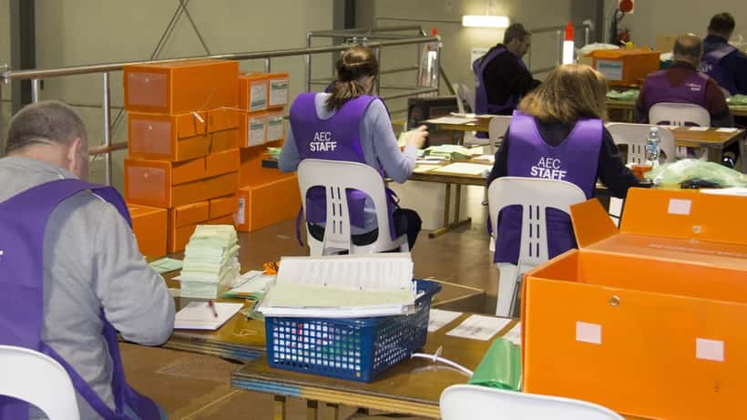 Australian Electoral Commission officials counting votes at a polling centre