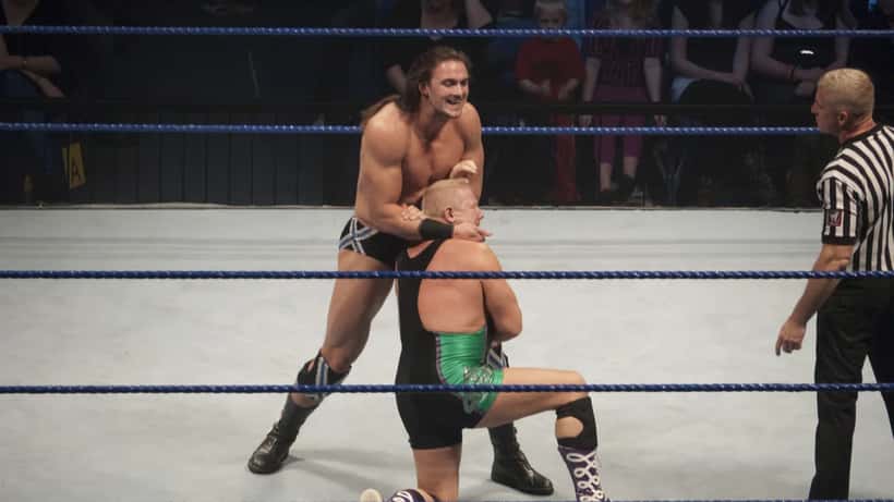 WWE superstar Drew McIntyre in action, whose on-screen 'I quit' moment sparked a real conversation about burnout and workplace limits