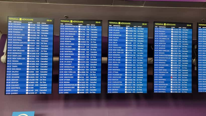 Airport departures board showing cancelled flights reflecting travel disruption from AVG Travels liquidation