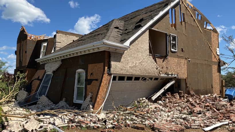 EF3 tornado damage to a residential home, showing destroyed walls and debris