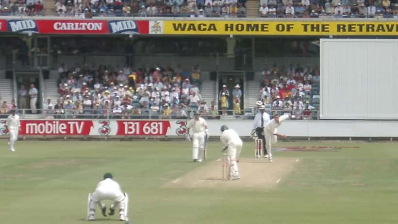 Cricket action shot from an Australia vs South Africa match showing a bowler in mid-delivery
