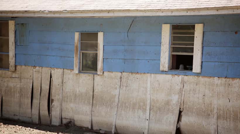 FEMA inspector assessing a house ravaged by flood waters in the United States