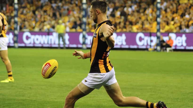 Jack Gunston kicking during an AFL match, Hawthorn Hawks 2026 season