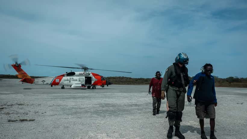 U.S. Coast Guard helicopter conducting aerial search and rescue over Atlantic Ocean