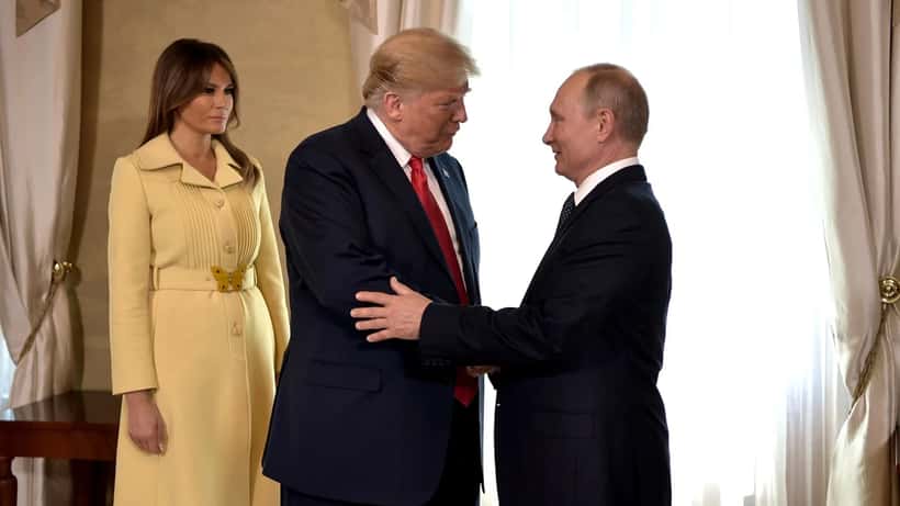 President Trump and President Vladimir Putin shaking hands at the Helsinki summit diplomatic meeting
