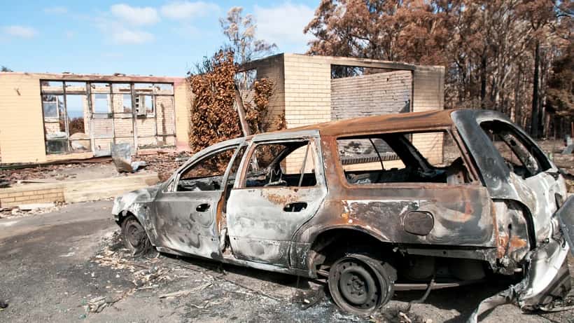 Burnt-out house and car in Kinglake after Australian bushfire