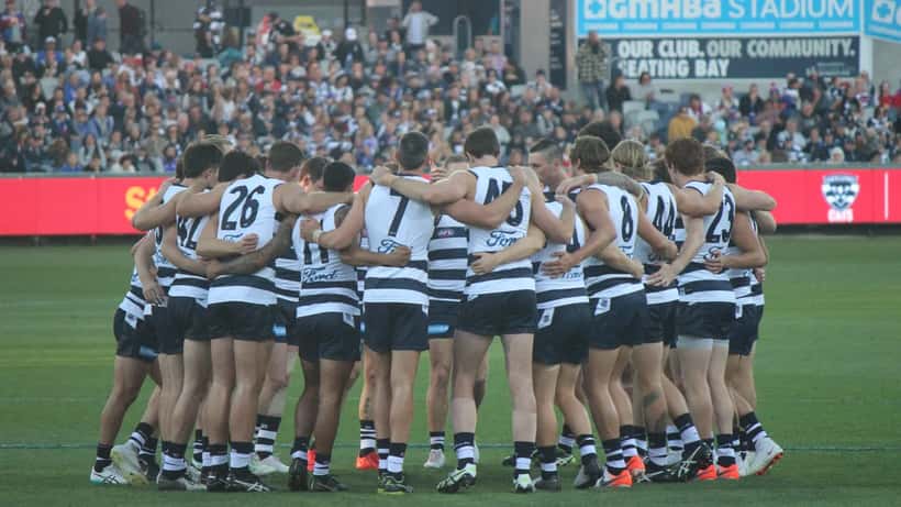 AFL players training on field, Australian football match