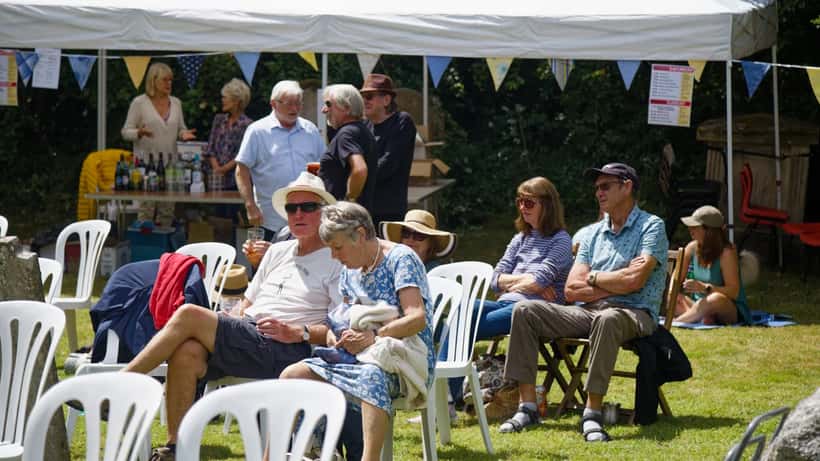 Crowd enjoying an outdoor music festival concert in summer