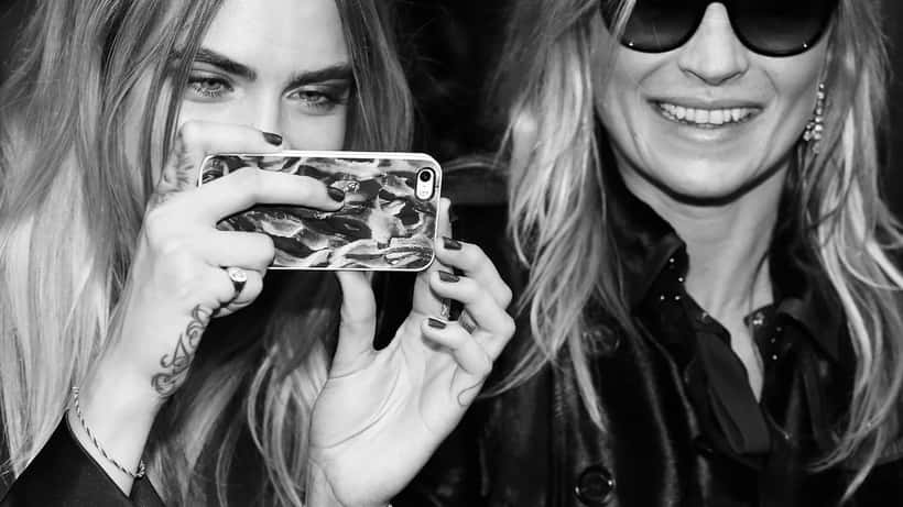 Kate Moss and Cara Delevingne at a public event, garden event context