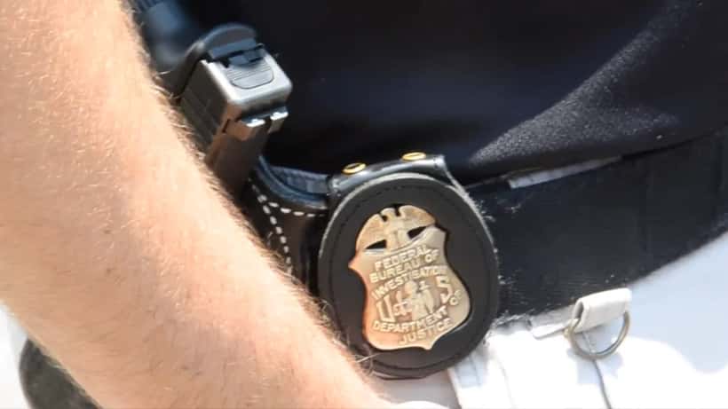 FBI agent badge and credentials, documentary press photo style