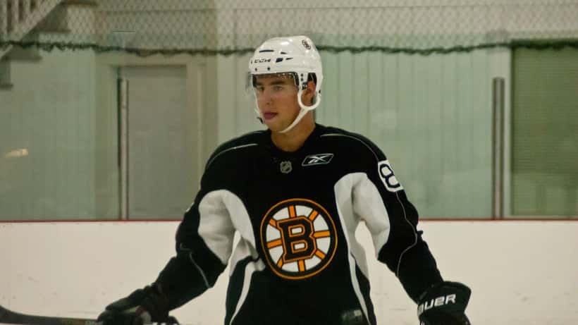 Boston Bruins player at NHL training camp during contract negotiation season 2026