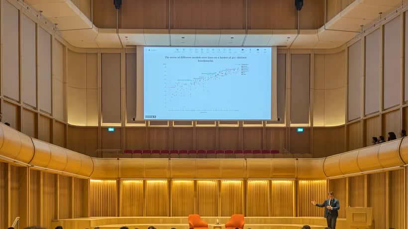 Anthropic co-founder Jack Clark presenting AI research at Oxford — wealth management perspective for Australian investors ahead of the 2026 IPO