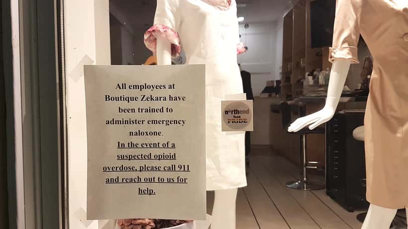 Street protest sign about Canada's opioid crisis in Halifax, highlighting fentanyl overdose deaths